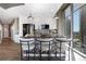 Stylish kitchen boasts island seating, modern appliances, and views from the oversized windows at 855 Peachtree Ne St # 1703, Atlanta, GA 30308