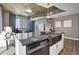 Contemporary island with stainless steel appliances, granite countertops, and a sink with city views at 855 Peachtree Ne St # 1703, Atlanta, GA 30308