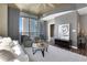 Open living area features contemporary furnishings, large windows, and views of the city skyline at 855 Peachtree Ne St # 1703, Atlanta, GA 30308