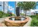 Outdoor water feature surrounded by lush landscaping, creating a tranquil and scenic environment with city views at 855 Peachtree Ne St # 1703, Atlanta, GA 30308
