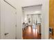 Hallway view into living area with hardwood floors and natural light streaming through the sliding doors at 870 Inman Village Ne Pkwy # 305, Atlanta, GA 30307