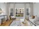 Modern living room featuring hardwood floors, balcony access, and stylish furnishings at 870 Inman Village Ne Pkwy # 305, Atlanta, GA 30307
