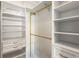 Organized walk-in closet with ample shelving, drawers, and hanging space for clothing and accessories at 870 Inman Village Ne Pkwy # 305, Atlanta, GA 30307