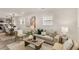 Open-concept living room with hardwood floors, stylish furnishings, and plenty of natural light at 1062 Grant Terrace, Atlanta, GA 30315