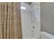 Bathroom features a shower/tub combination with white tile surround at 1215 Wynridge Xing, Alpharetta, GA 30005