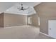 Large bedroom with neutral carpet, a tray ceiling, and natural light, offering a calming retreat at 1215 Wynridge Xing, Alpharetta, GA 30005