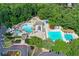 Overhead aerial view showcasing an expansive community pool complex featuring an active splashpad area at 1215 Wynridge Xing, Alpharetta, GA 30005