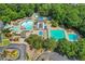 Aerial view of community pool with water slide, baby pool, mushroom fountain, splash pad, lap pool and lounge area at 1215 Wynridge Xing, Alpharetta, GA 30005