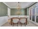 Cozy dining room featuring a wooden table, a chandelier, and large windows at 1215 Wynridge Xing, Alpharetta, GA 30005