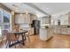 Bright, modern kitchen with hardwood floors, stainless steel appliances, and stylish pendant lighting at 1215 Wynridge Xing, Alpharetta, GA 30005