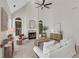 Sunlit living room featuring a fireplace, vaulted ceilings, and a neutral color palette for a serene setting at 1215 Wynridge Xing, Alpharetta, GA 30005