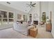 Bright living room with a fireplace, high ceilings, arched windows, and neutral decor for a cozy, inviting atmosphere at 1215 Wynridge Xing, Alpharetta, GA 30005