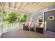 Back porch featuring outdoor furniture and a view of backyard at 4259 Kings Troop Rd, Stone Mountain, GA 30083