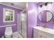 Bathroom with a glass-enclosed shower, modern vanity and decorative lighting at 4259 Kings Troop Rd, Stone Mountain, GA 30083