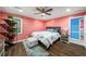 Bedroom features hardwood floors, ceiling fan and ensuite laundry room at 4259 Kings Troop Rd, Stone Mountain, GA 30083