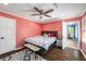 Bedroom featuring hardwood floors, ceiling fan and decorative trim at 4259 Kings Troop Rd, Stone Mountain, GA 30083