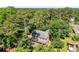 Charming two-story home featuring a welcoming front porch and surrounded by lush greenery at 4259 Kings Troop Rd, Stone Mountain, GA 30083