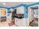 This kitchen features stainless steel appliances, white cabinets, and access to the dining room at 4259 Kings Troop Rd, Stone Mountain, GA 30083