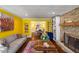 Living room boasts hardwood floors, a brick fireplace, and colorful decor at 4259 Kings Troop Rd, Stone Mountain, GA 30083
