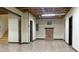 A basement featuring a brick fireplace and tile flooring at 430 English Ivy Way, Woodstock, GA 30188