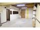 Basement features fluorescent lighting and exposed ceiling at 430 English Ivy Way, Woodstock, GA 30188