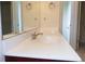 Bathroom featuring white countertop, sink, faucet, and mirror at 430 English Ivy Way, Woodstock, GA 30188