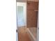 Bathroom featuring tiled shower/tub and an open doorway at 430 English Ivy Way, Woodstock, GA 30188