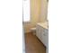 Bright bathroom featuring tile floors, white vanity, and a toilet at 430 English Ivy Way, Woodstock, GA 30188