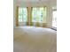 Bedroom featuring natural light, curtains, and access to the backyard at 430 English Ivy Way, Woodstock, GA 30188