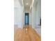 Hallway with hardwood floors, leading to various rooms in the home at 430 English Ivy Way, Woodstock, GA 30188