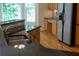 Kitchen featuring granite countertops, stainless steel sink, light wood cabinets, and hardwood floors at 430 English Ivy Way, Woodstock, GA 30188