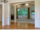 Open floorplan showing living room and dining room, featuring natural light from multiple windows at 430 English Ivy Way, Woodstock, GA 30188