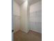 Empty walk-in closet with shelving, ready for customization at 430 English Ivy Way, Woodstock, GA 30188