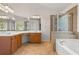Well-appointed bathroom with a separate tub, glass shower, and double vanity sinks at 795 Creek Glen Rd, Mableton, GA 30126