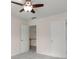 Carpeted bedroom with white doors offering seamless transition and simple design at 795 Creek Glen Rd, Mableton, GA 30126