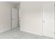 Carpeted bedroom with white doors offering seamless transition and simple design at 795 Creek Glen Rd, Mableton, GA 30126