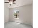 Well-lit bedroom with a ceiling fan and views of the outdoors through a large window at 795 Creek Glen Rd, Mableton, GA 30126