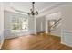 The dining room boasts bright natural light, hardwood floors, and classic trim details at 795 Creek Glen Rd, Mableton, GA 30126