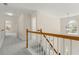 Upstairs hallway with natural lighting, carpeted floors, and wooden banisters at 795 Creek Glen Rd, Mableton, GA 30126