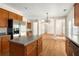 Open kitchen with a stainless steel fridge, kitchen island, and seamless access to the living room at 795 Creek Glen Rd, Mableton, GA 30126