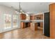 A kitchen with wooden cabinets, an island, and doors leading to the backyard at 795 Creek Glen Rd, Mableton, GA 30126