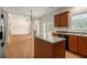 Bright kitchen featuring an island, wood cabinets, sleek countertops, and an open layout at 795 Creek Glen Rd, Mableton, GA 30126