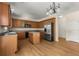 Kitchen featuring wood cabinets, stainless steel appliances, and an island at 795 Creek Glen Rd, Mableton, GA 30126