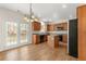 A spacious kitchen featuring wood cabinets, stainless steel appliances, and an island at 795 Creek Glen Rd, Mableton, GA 30126