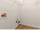 Convenient laundry area with shelving and connections for essential appliances at 795 Creek Glen Rd, Mableton, GA 30126