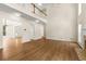 Expansive living room with hardwood floors, tall ceilings, fireplace, and ample natural light at 795 Creek Glen Rd, Mableton, GA 30126