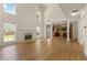 Spacious living room with hardwood floors, fireplace, and bright windows offering natural light at 795 Creek Glen Rd, Mableton, GA 30126