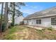 View of a backyard featuring a combination of green grass, and patio area at 104 Terrapin Ct, Carrollton, GA 30116