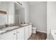Bright bathroom with double sinks, tile floor, and granite counters at 104 Terrapin Ct, Carrollton, GA 30116