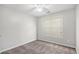 Light-filled bedroom with carpet, a modern ceiling fan, and a window for ample natural light at 104 Terrapin Ct, Carrollton, GA 30116